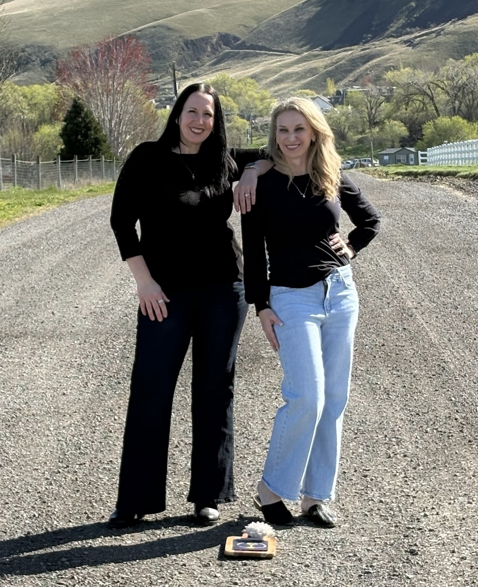 Andrea and Leah on a road